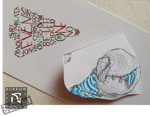 An interactive illustrated Christmas card showing a sleeping armadillo